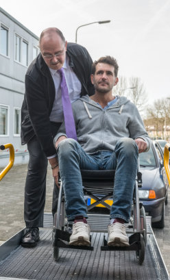 man in a wheelchair looking at the camera