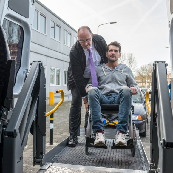 Man helping to get on the car